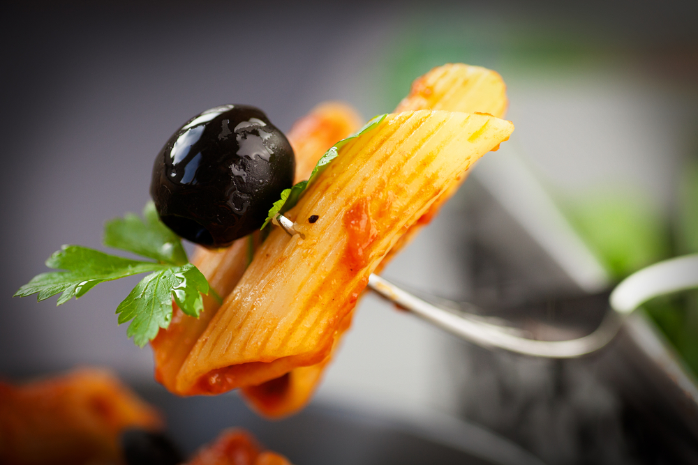 Italian,food.,pasta,penne,with,tomato,sauce,,olives,and,garnish