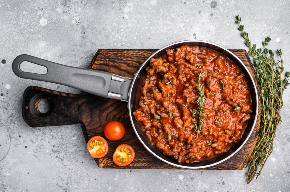 Italian,bolognese,sauce,with,ground,beef,in,a,pan.,grey